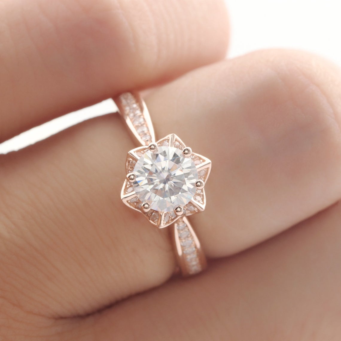 moissanite ring on finger