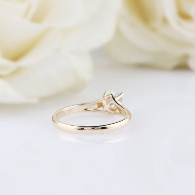 gold round cut moissanite ring