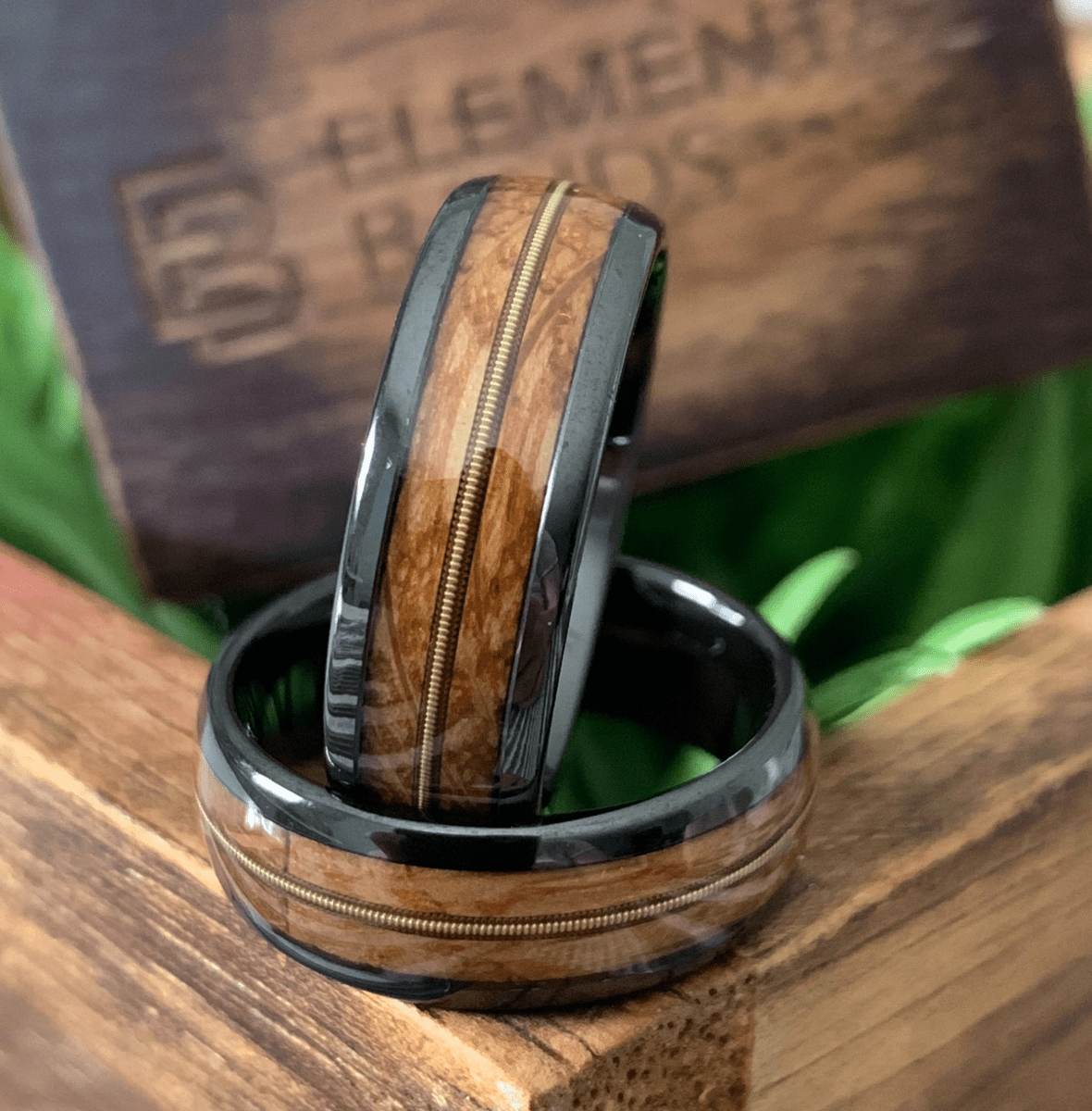 black ceramic whiskey barrel ring with guitar string inlay