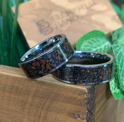 Men's tungsten wedding band with red dinosaur bone fossil inlay