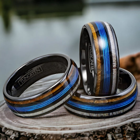 black tungsten ring with blue fishing line, whiskey barrel, and deer antler inlay.