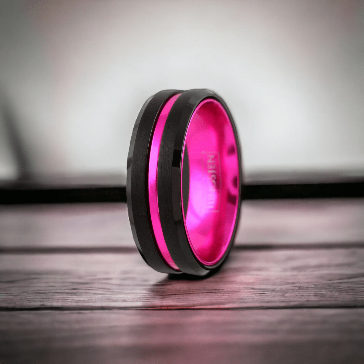 Hot pink wedding band with black tungsten beveled edges 
